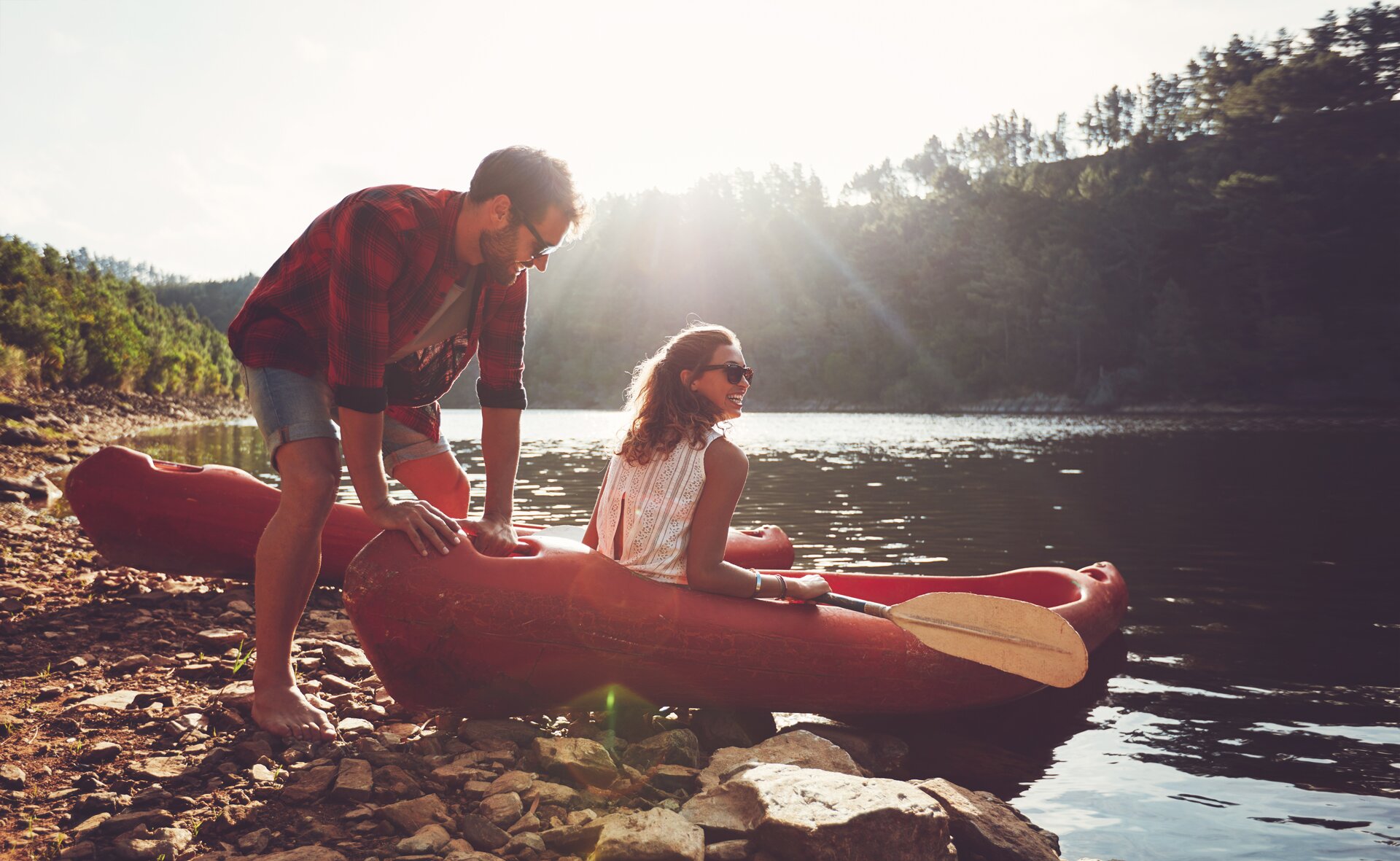 Couple happy canoeing in the river