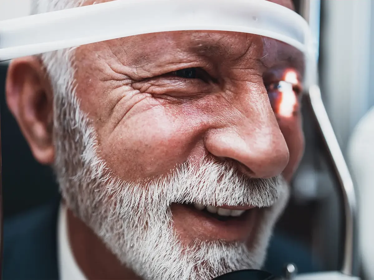senior man during light adjustable lens treatment
