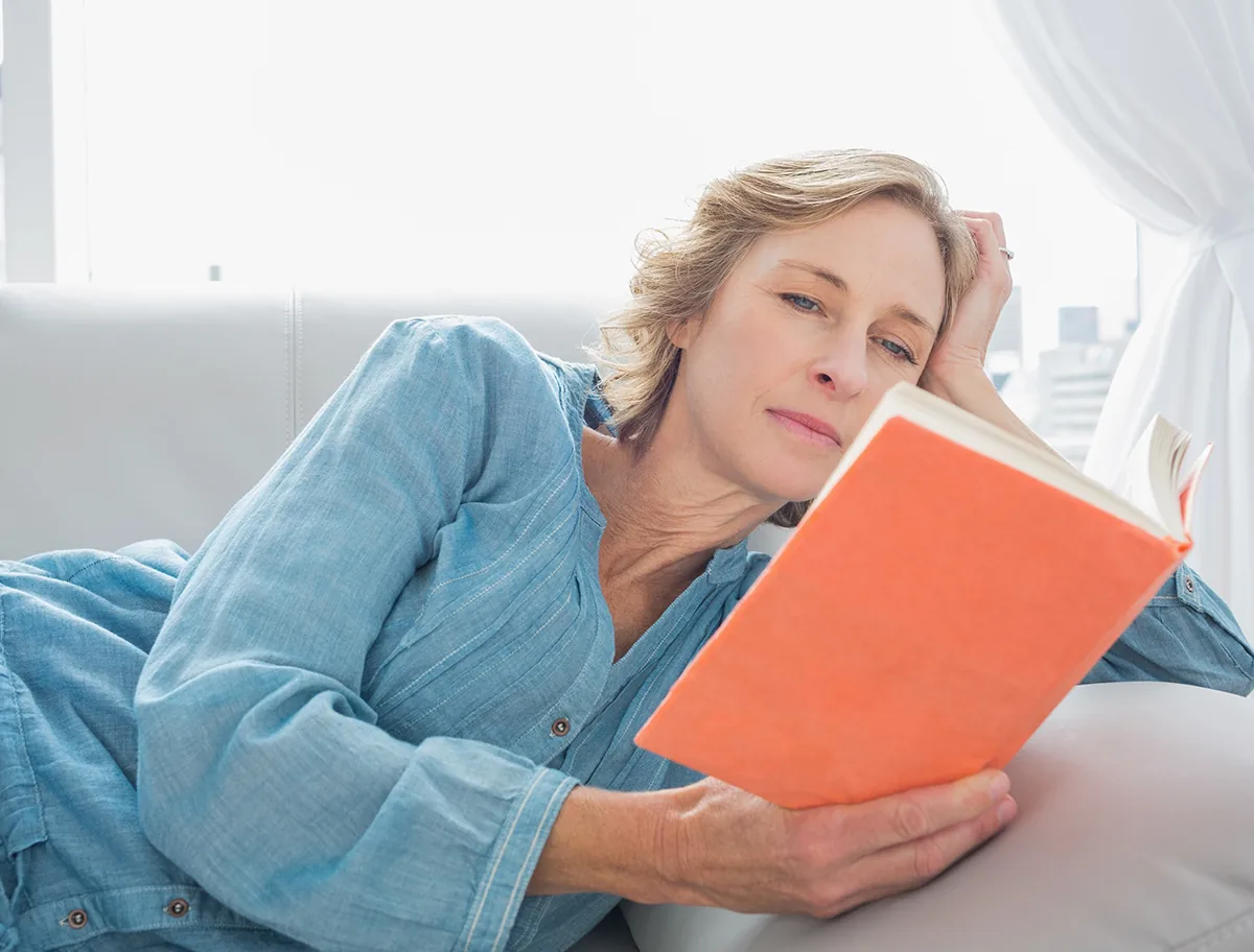 senior woman reading book